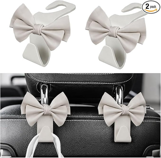 2PCS Cute Bow Car Seat Headrest Hook, Multifunctional Backseat Storage Hanger for Purse Handbag Coat, Automotive Seat Back Bag Holder Organizer, Universal for SUV RV Truck (White)